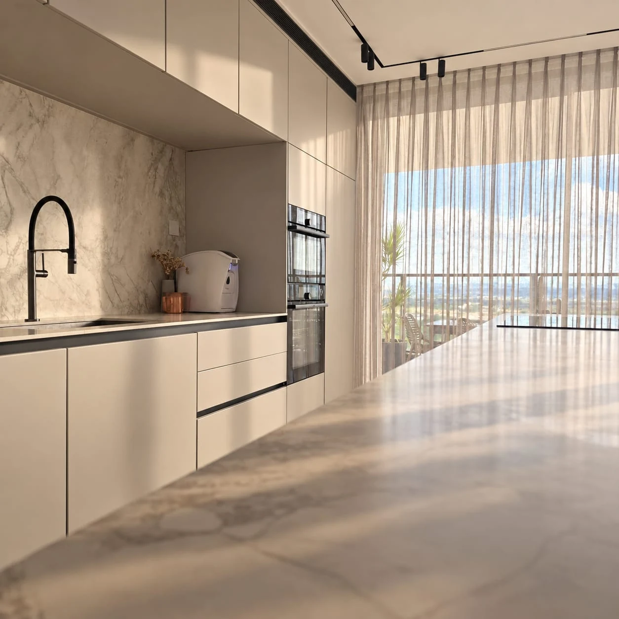 Pale kitchen cabinetry, sink and worktop facing the window