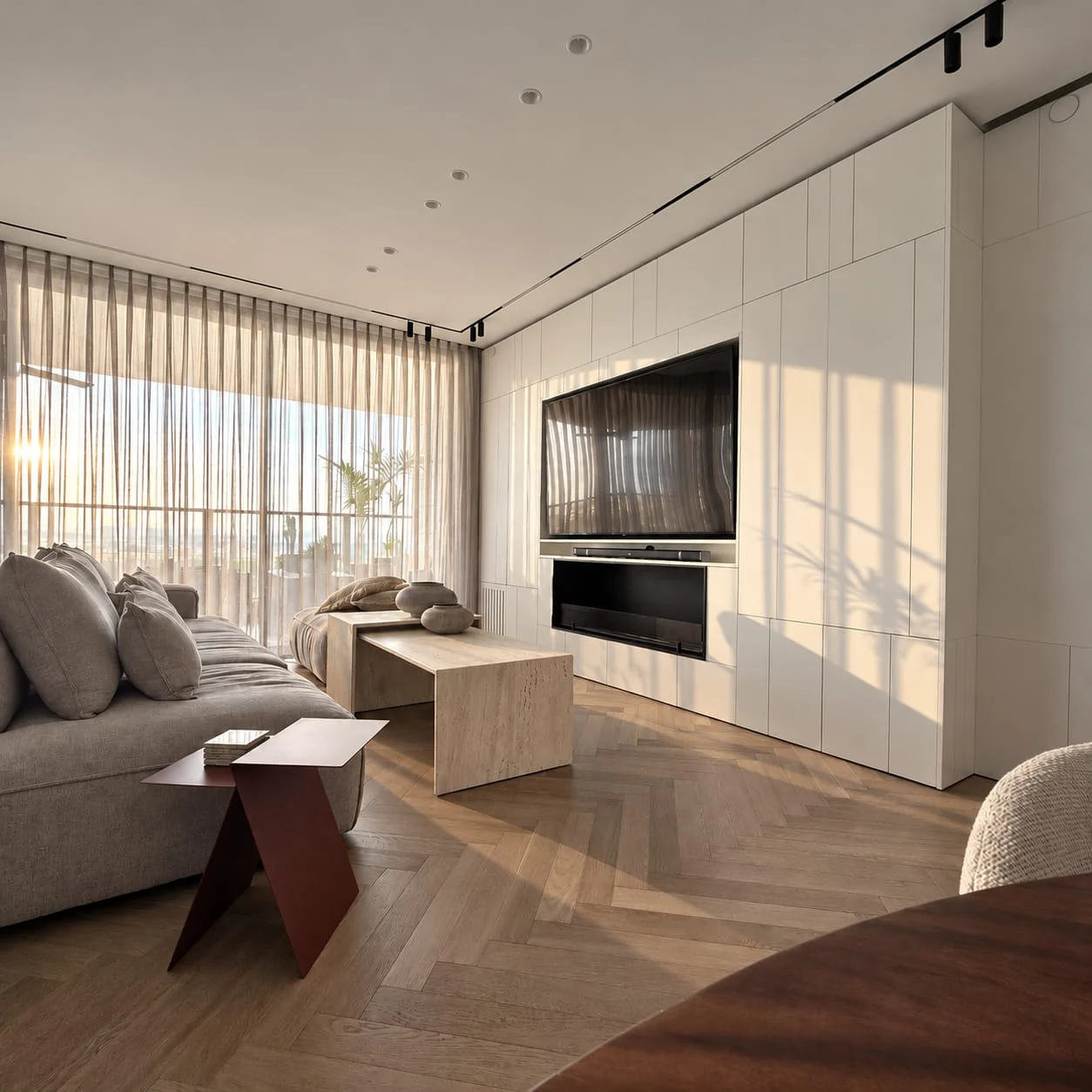 Sofa beside the windows and television wall, viewed from the dining area