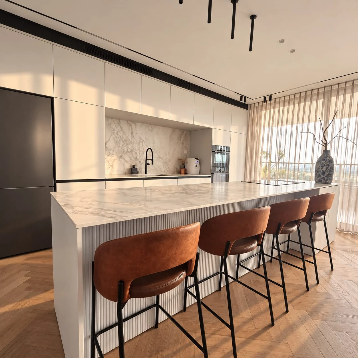 Cognac-coloured stools along the island facing pale kitchen cabinetry