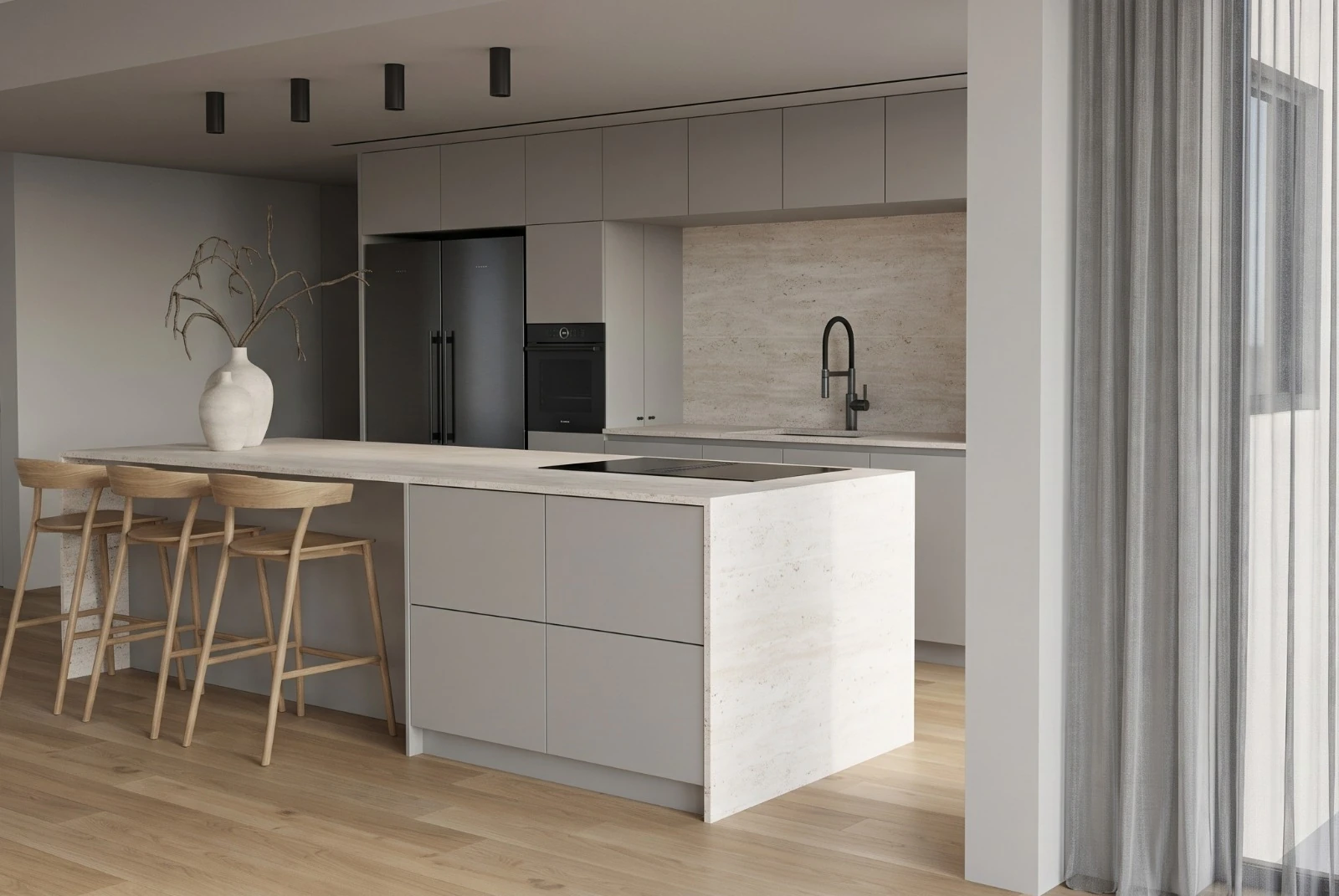 Gray kitchen island with drawers and a stone end panel, beside floor-to-ceiling curtains.